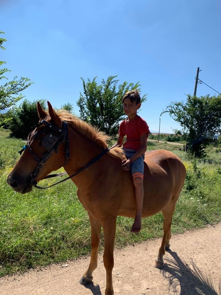 A young boy riding bareback on a horse – Bulgarian Village life