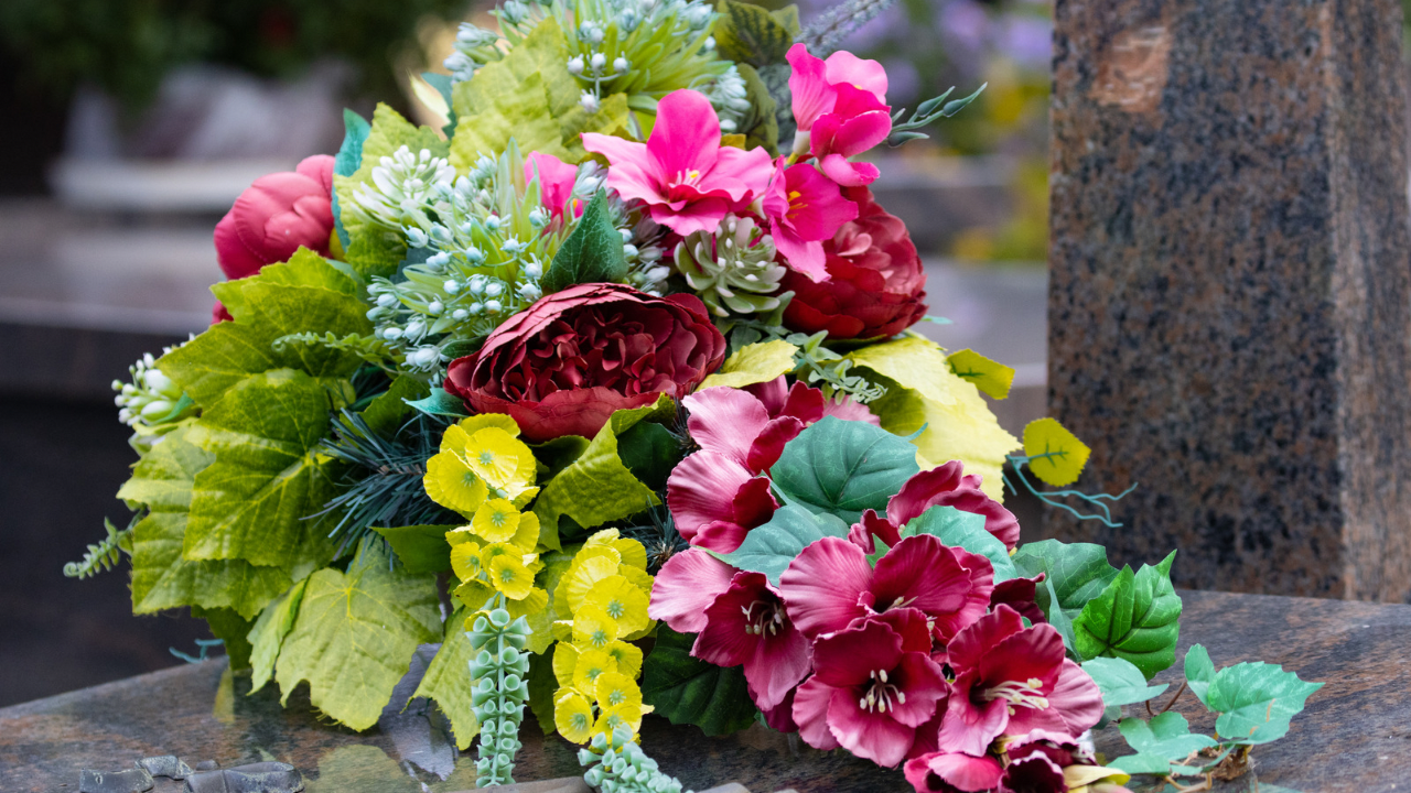 Beautiful flowers on a grave - All Souls Day