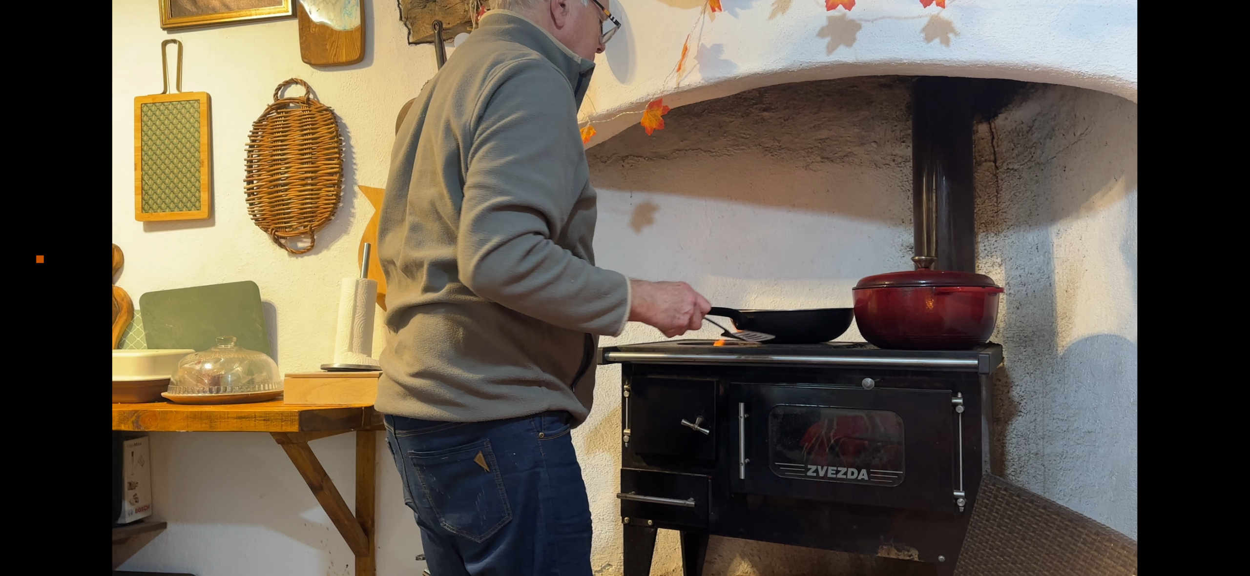 My husband cooking breakfast on the wood stuff